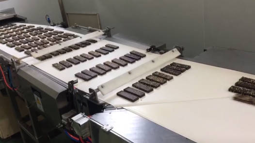 Alimentador y Envolvedora Flow Pack DXD-660 Automáticos para Recubiertos de Chocolate